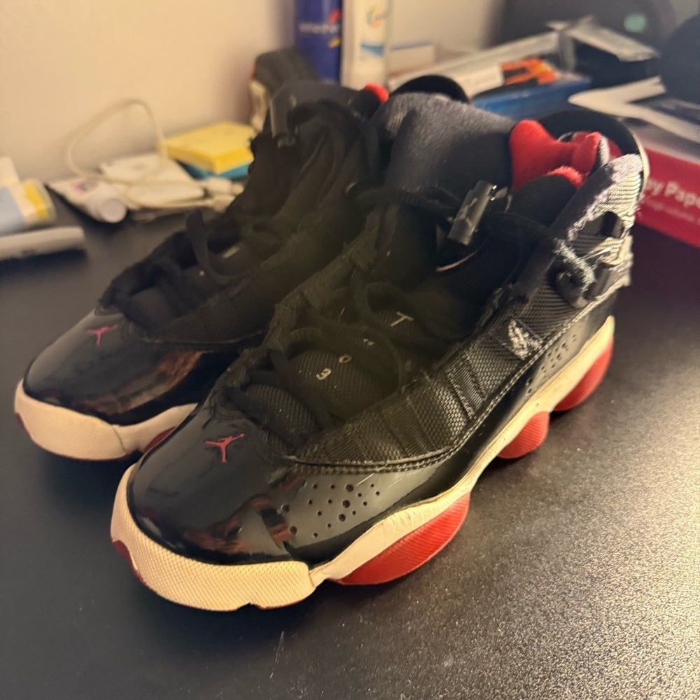 Jordan 11 Retro Bred Size 5.5 in women or 3.5 in youth or a 4 in men